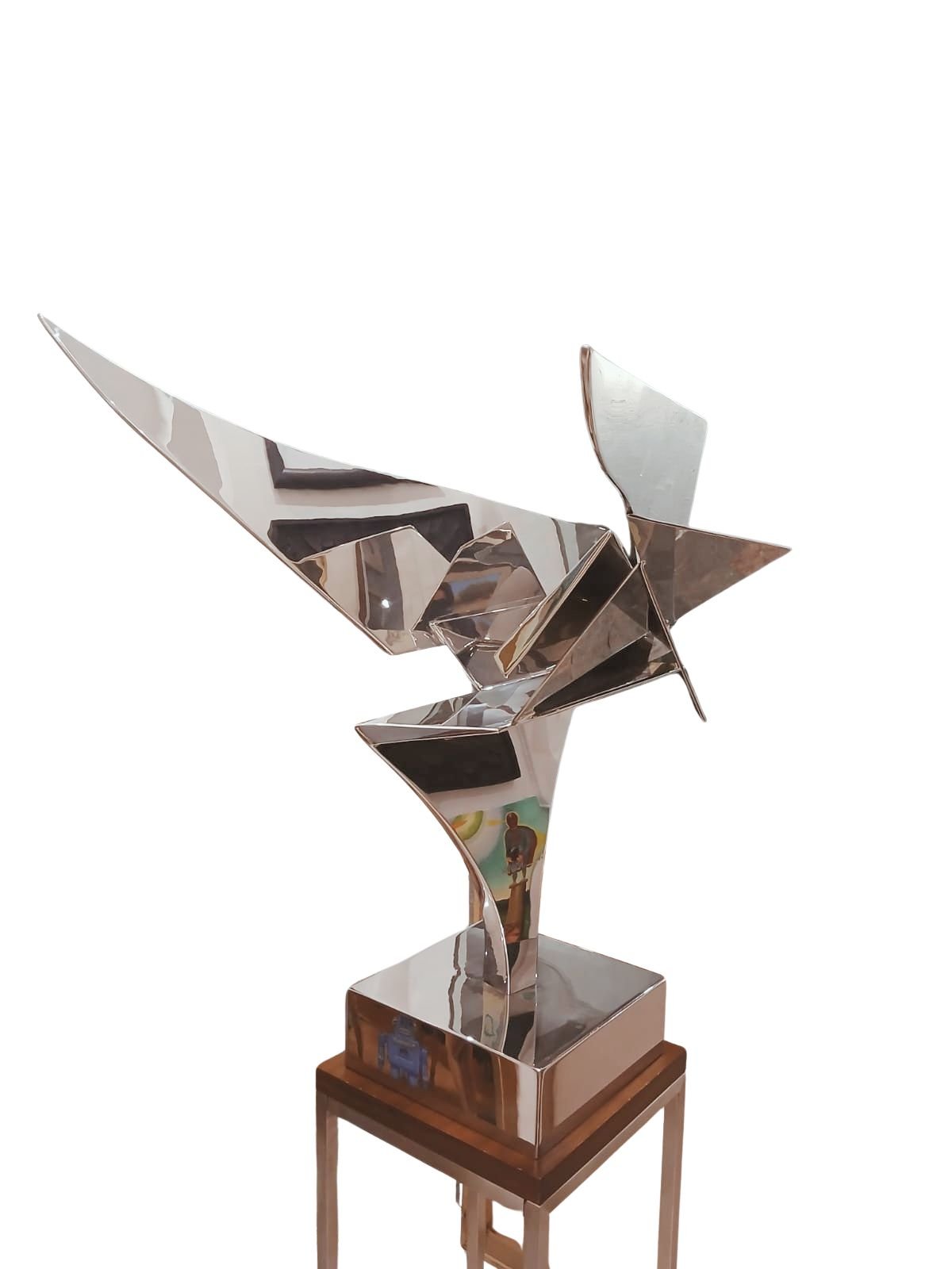 Leonardo Nierman escultura original acero inoxidable ave geometrica abstracto pulido espejo