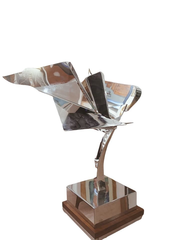 Leonardo Nierman escultura original acero inoxidable ave geometrica abstracto pulido espejo